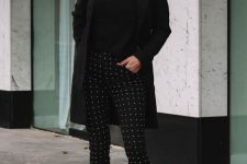an elegant total black look with a turtleneck, a short coat, printed pants and heels is extremely chic