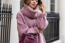an overiszed pink sweater with a turtleneck, a black leather mini skirt, a burgundy bag for a sexy winter look