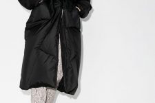 black booties, snakeskin print pants, a black puffer coat with a belt for a trendy winter look