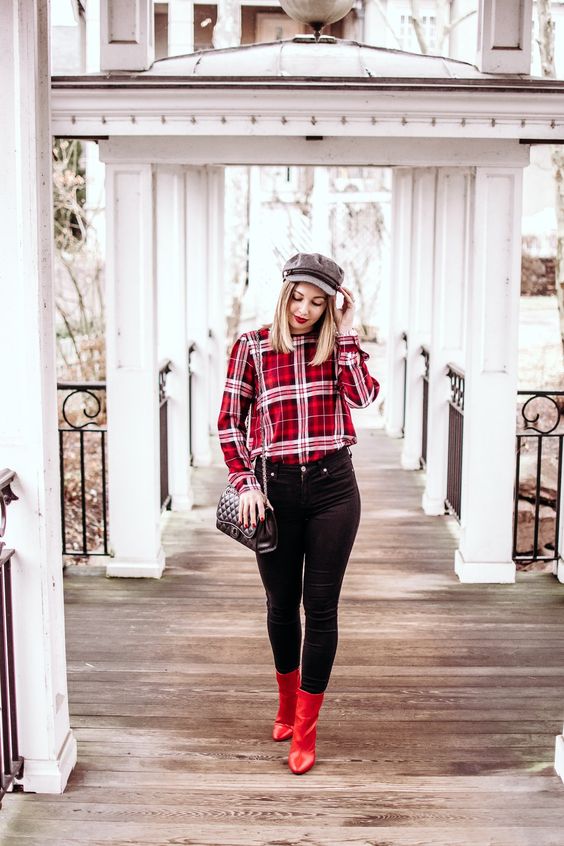 black skinnies, red boots, a red plaid shirt, a black bag and a grey cap for an everyday Christmas look