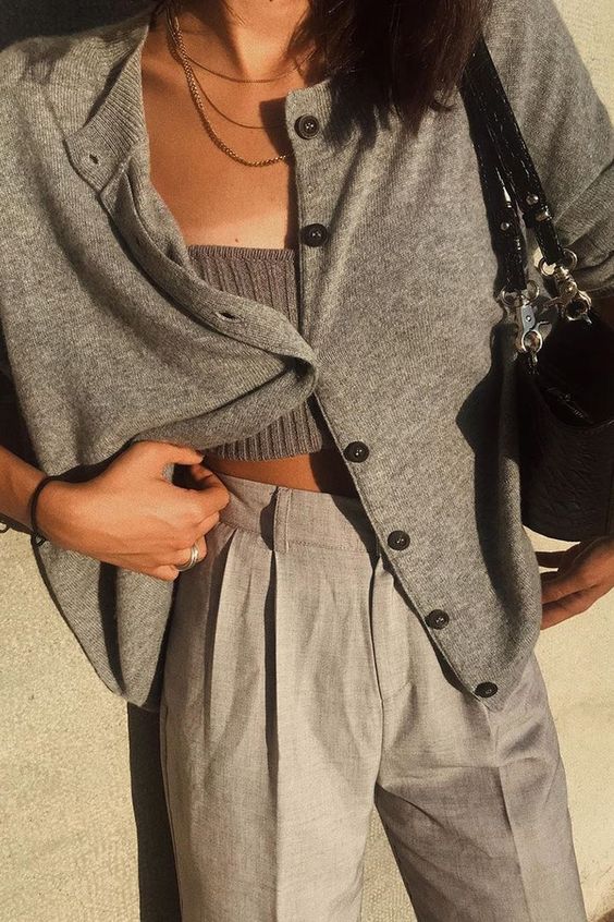 grey pants, a grey knit top and a matching cardigan plus a black bag for a comfortable everyday look