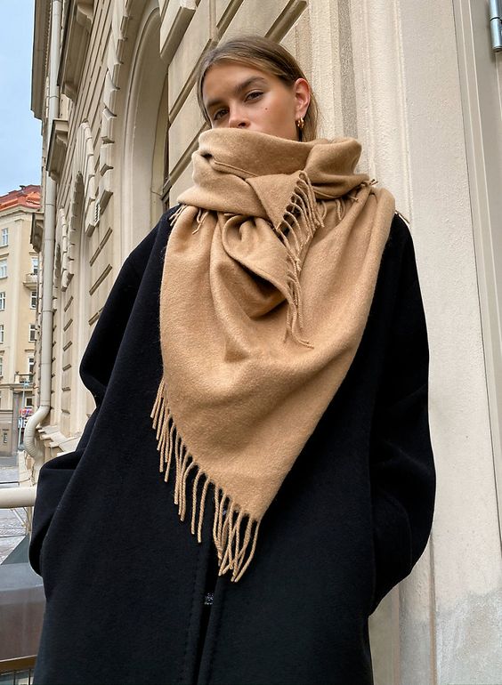 such a tan scarf with a bit of fringe is classics for fall and winter and will be always actual, its basic color will help it fit many looks