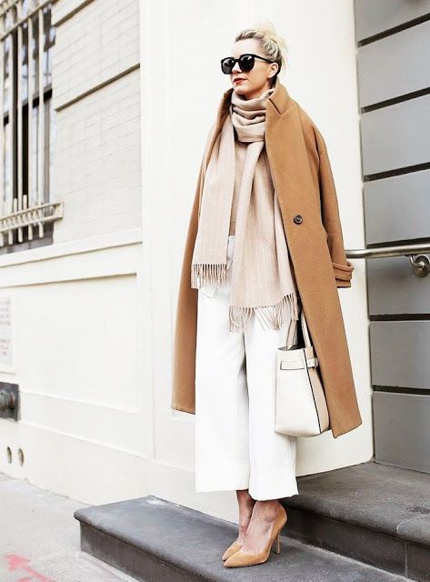 white pants, tan shoes, a blush oversized scarf, a tan coat and a neutral bag for an ethereal winter look