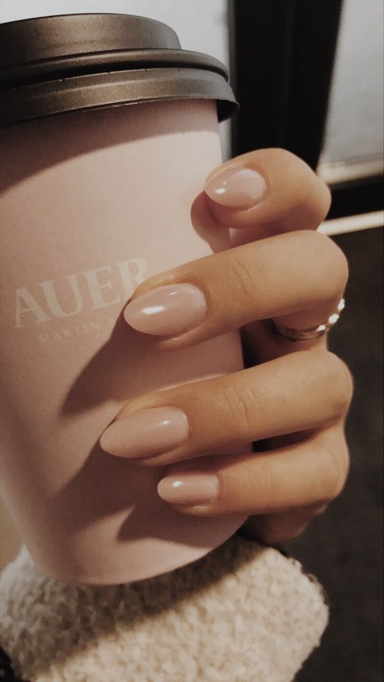 glossy nude nails of a soft shape are a great trend for now and they will all your looks