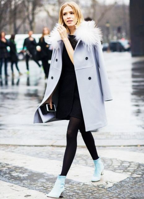 With black dress and pastel colored coat