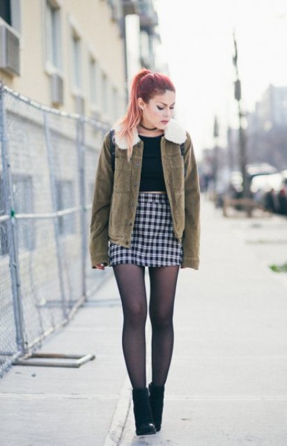 With black shirt, checked mini skirt and black ankle boots