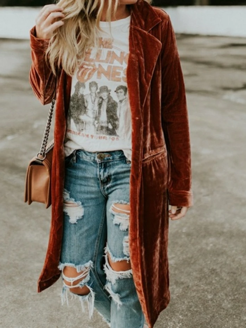 With t-shirt, distressed jeans and chain strap bag