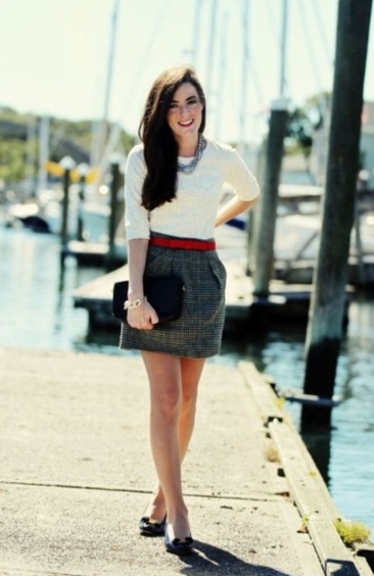 With white sweater, black clutch and black shoes