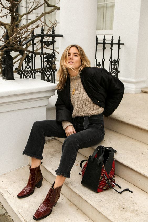a chunky knit sweater, black jeans, burgundy boots, a black bomber jacket and a tartan bag for winter