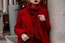a dramatic total red look with a sweater, pants, a coat and a black bag plus a dark lip is wow