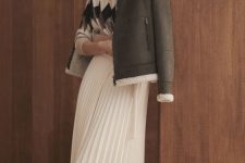 a geometric print sweater, a white pleated midi, a crown and white shearling jacket and boots