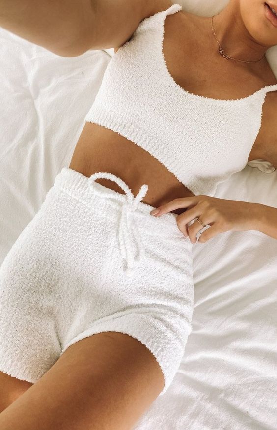 a perfect white fluffy two-piece knit set of a crop top and high waisted shorts is ideal for home and not only