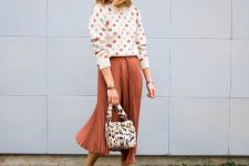 a pretty polka dot sweater, a terracotta pleated midi and a fluffy faux fur bag for a girlish feel