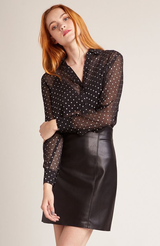 a simple and sexy look with a black leather mini skirt, a sheer polka dot blouse and a black bra under it is a timeless idea