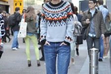 a stylish and bold look with a retro-inspired fair aisle sweater, blue jeans and black cutout booties