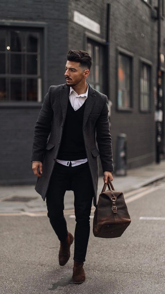 a white shirt, a black jumper, black jeans, burgundy suede boots, a grey coat and a brown bag