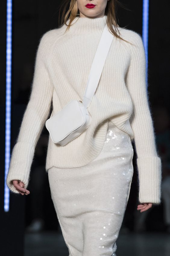 a white turtleneck sweater, a white sequin skirt and a small crossbody bag for a beautiful holiday look