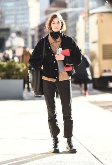 With brown button down shirt, black turtleneck, tote bag, cropped pants and lace up boots