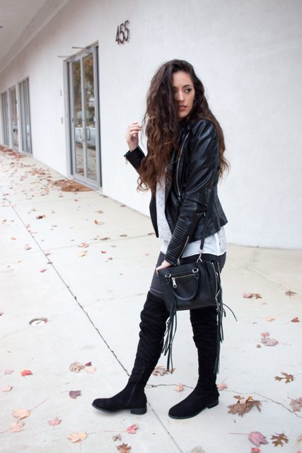 With pants, black leather jacket, long t-shirt and bag