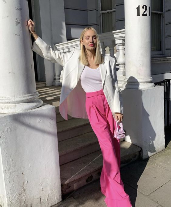 a chic look with a white top, an oversized white blazer, bubblegum pink pants and a mini bag