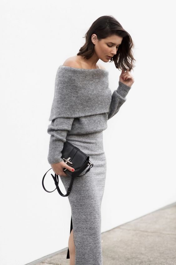 a grey off the shoulder sweater, a midi skirt and a black bag compose a chic minimal look for a date or a party