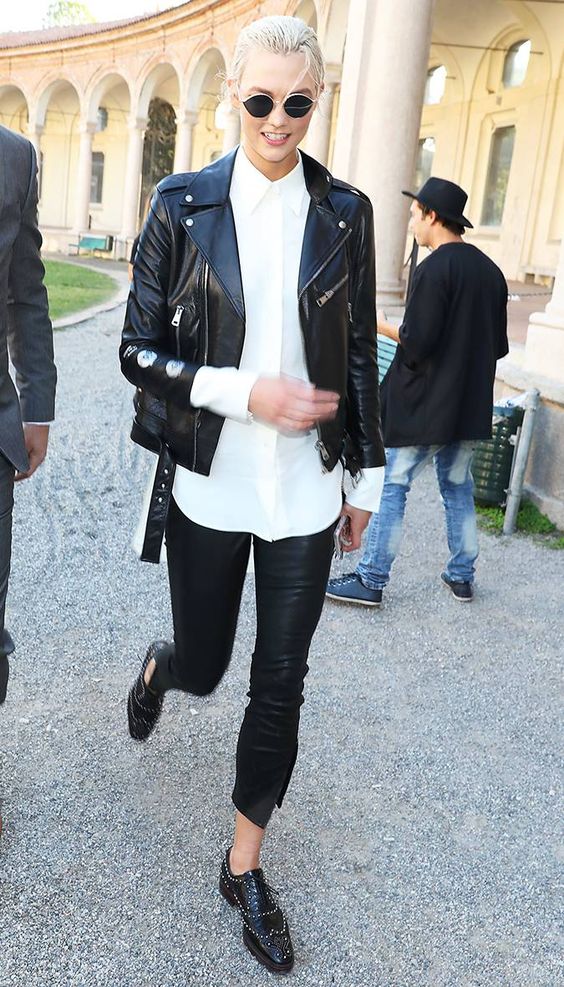 a rock look with a white shirt, black leather pants, black studded Derby shoes and a black leather jacket