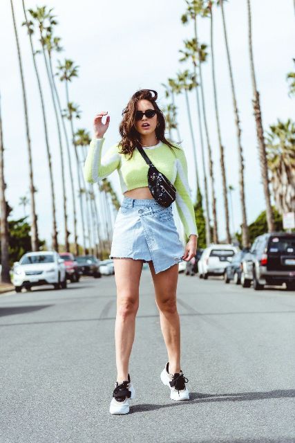 With crop shirt, denim skirt and black and white sneakers