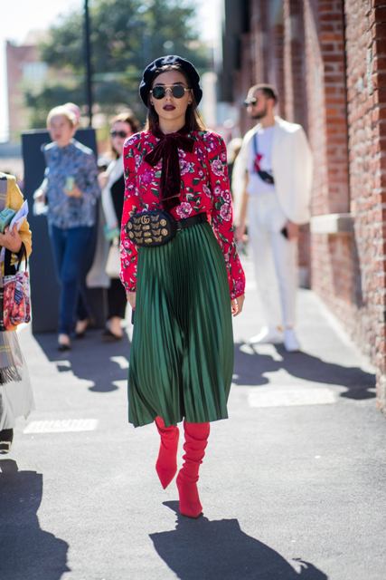 With floral blouse, marsala tie, emerald pleated skirt and pink high boots