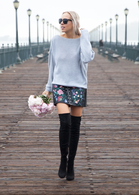 With light blue loose sweater and black suede over the knee boots