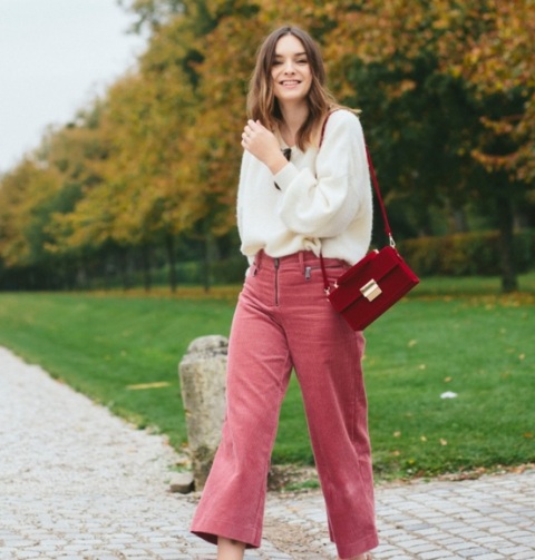 With white loose sweater and marsala bag