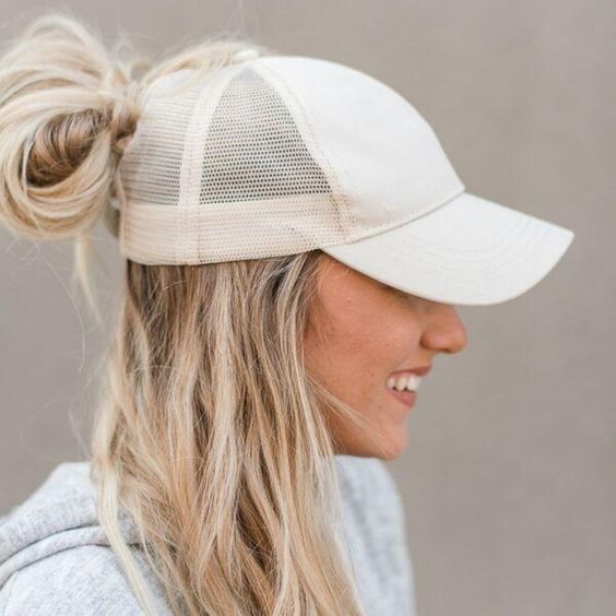 a baseball cap, a half updo with messy hair down and a messy midi bun are a cool idea that is comfy to wear