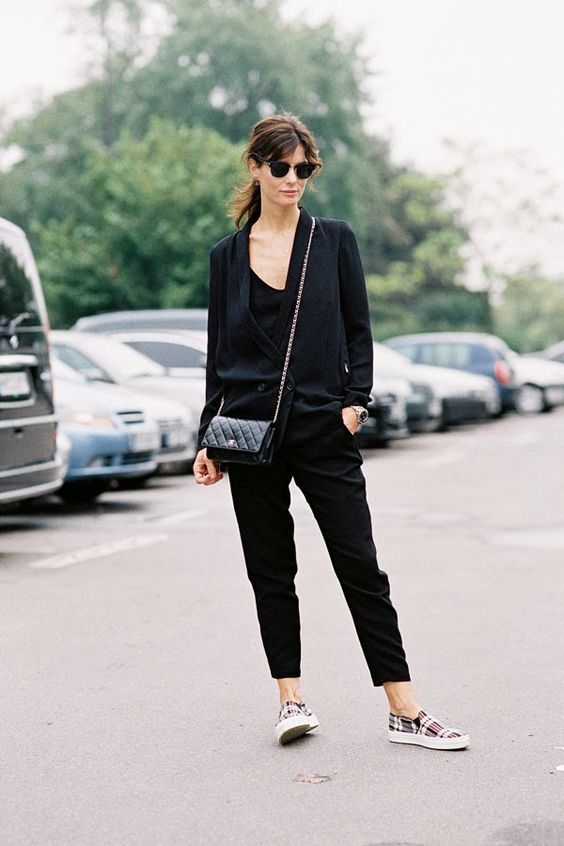 a black jumpsuit, a black oversized blazer, a mini bag and plaid slipons for a comfy work look