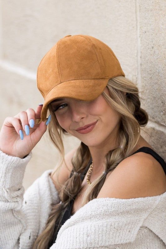 a cap paired with two messy braids are a lovely idea that looks super cute, chic and lovely