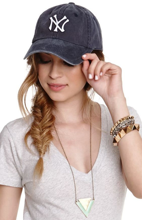 a side fishtail braid, some face-framing hair and a baseball cap are a cool combo for a every day, suitable for medium and long hair