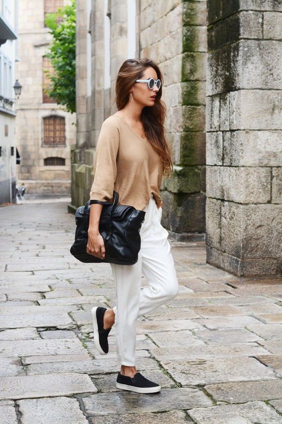 a tan jumper, white cropped pants, black slipons, a black oversized bag for every day
