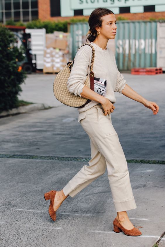 grey pants, a grey jumper, a cool bag and rust shoes for a retro-inspired look