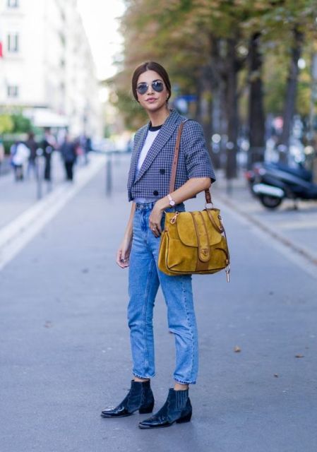 With black and white t-shirt, yellow suede bag, cropped jeans and navy blue leather and suede ankle boots
