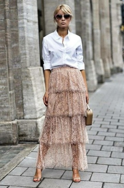 With white button down shirt, beige bag and ankle strap shoes