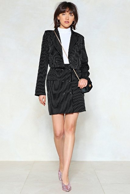 With white turtleneck, striped mini skirt, chain strap bag and silver pumps