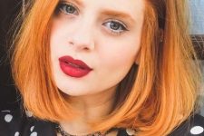 a long ginger bob with a lot of volume and curved ends is a cool and chic idea, a classic haircut with a bold color