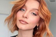 a pretty long bob done in copper shades and with ginger balayage, with volume and waves, is perfect fot the fall