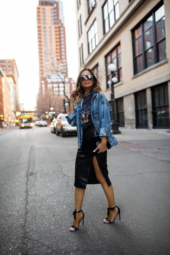 a rock look with a black printed tee, a black leather midi with a slit, a blue denim jacket and black heels