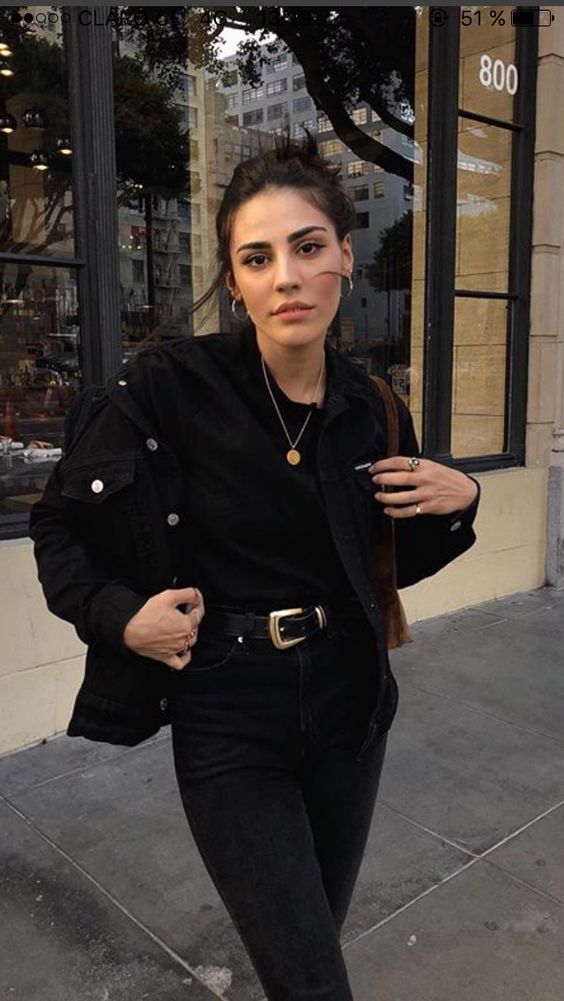 a total black look with a denim jacket, jeans, a t-shirt and bold accessories is all chic