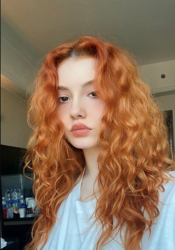 amazing long ginger hair with waves and a lot of volume is amazing, it will be a nice experiment for the fall