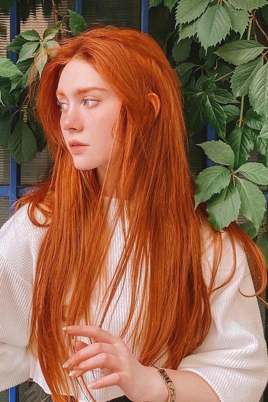 An elvish hairstyle with super long straight ginger hair with some volume is a jaw dropping idea