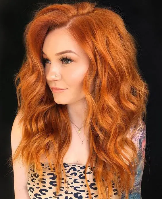 gorgeous ginger hair with side parting, a lot of volume and some waves is an amazing idea to try