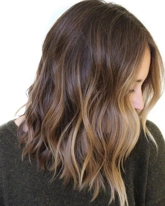 gorgeous rich brown wavy hair with chic sunkissed balayage and waves is a lovely idea to embrace the summer with your look