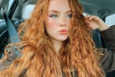 jaw-dropping long ginger hair with waves and a lot of volume is amazing, it looks absolutely spectacular