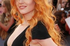 long and wavy ginger hair with a lot of volume looks jaw-dropping, it’s amazing and outstanding