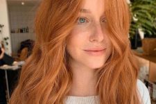 long copper and ginger hair with a lot of volume and waves is a lovely idea, it looks very bright and eye-catching